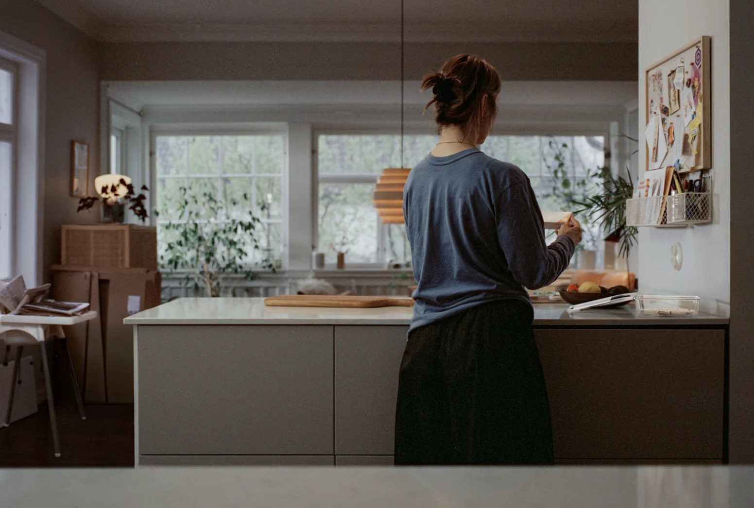 Still from the campaign: a woman in a kitchen