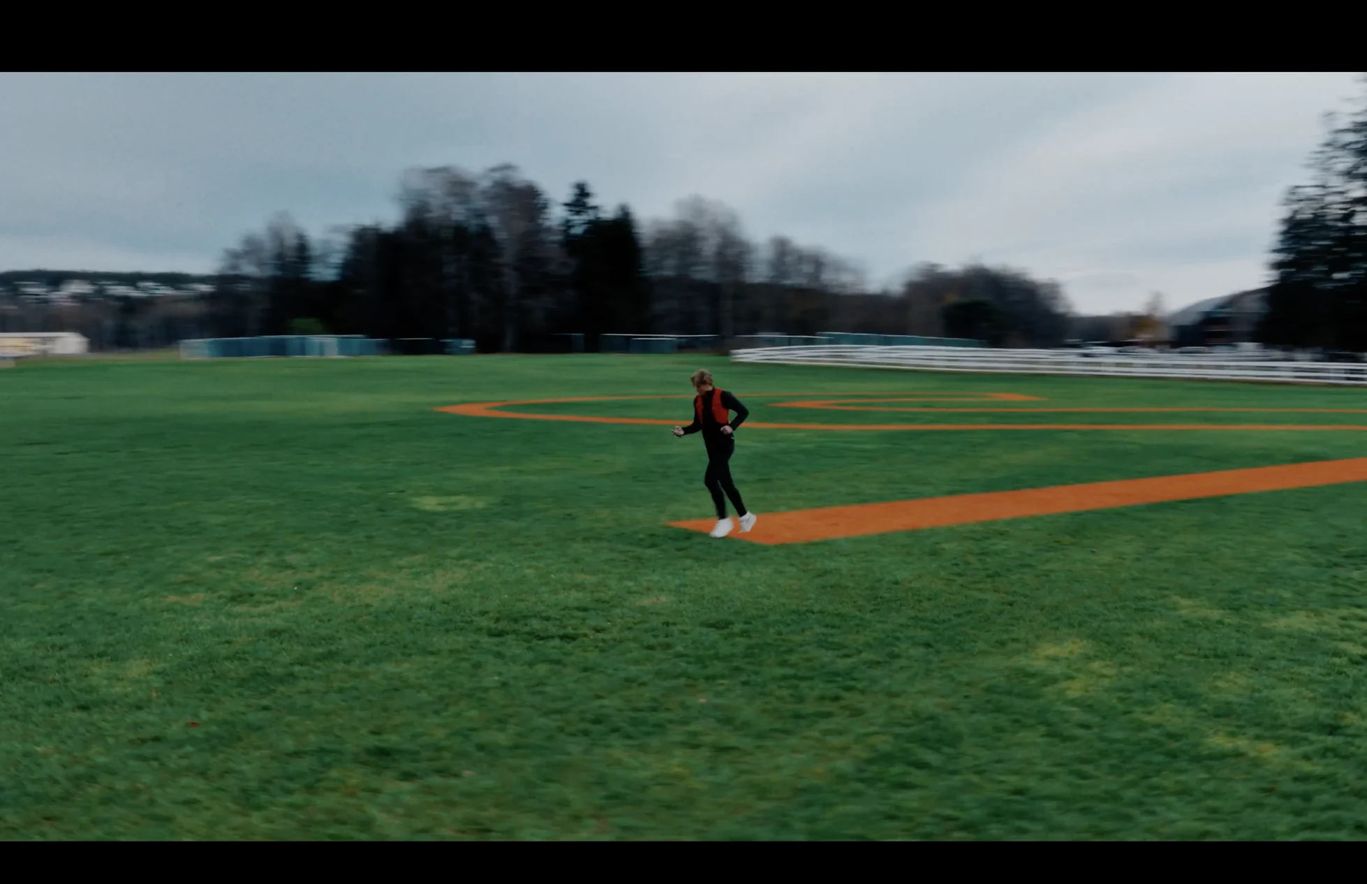 Runner on a football pitch
